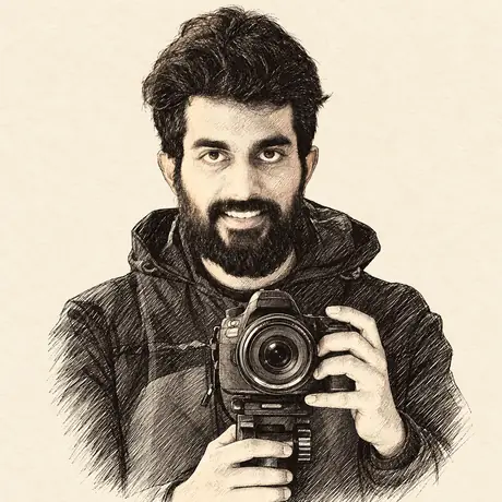 Cian, drawn in pen and ink, holding a camera